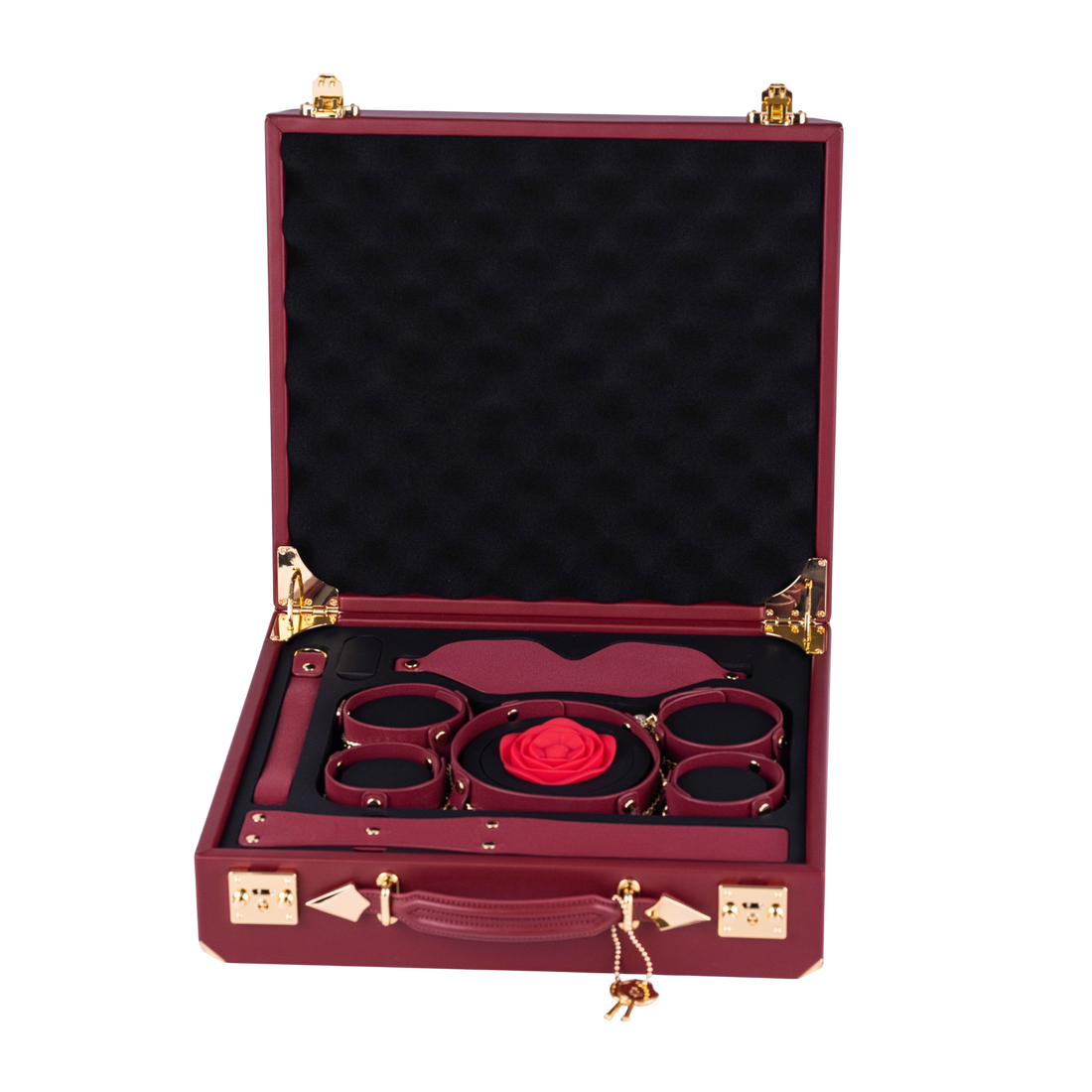 The red CRYSTAL case open, six pieces around the red rose gag in a black tray